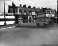 Buses & Shops including, Joseph Laycock, watch repairer, R.V. Butcher, ...
